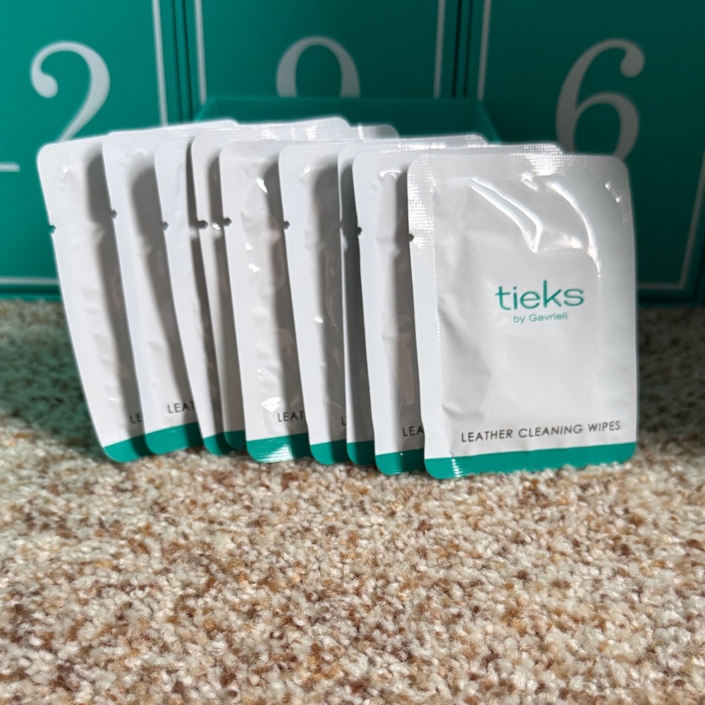Tieks Leather Cleaning Wipes in White and Teal Packaging